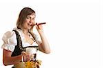 Close-up of a Bavarian Girl dressed with a Dirndl holding an Oktoberfest Beer Stein in her hand and one Cuban cigar