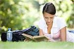 attractive girl learning in park