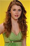 Pretty auburn haired teenager in a green dress