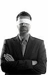 Blindfolded businessman over white background, conceptual image