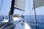 Sailing with an old sailboat over blue mediterranean summer sea