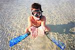 Funny young man ready for fun at sunny beach