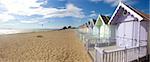 mersea beach huts and cloudscape in summer