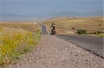 Travel by bicycles in Armenia - man on the bicycles on the route