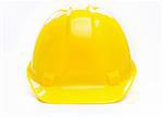 Yellow Hard  plastic hat on the white background