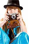 Girl in retro hat with vintage camera