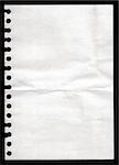 White paper pulled out from a notebook on a black background