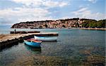 two boats by a quay, old town of Ohrid at the backgroud