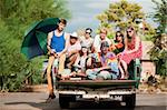 Portrait of Groovy Group in the Back of Truck