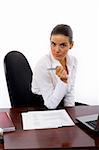 Young businesswoman in the office holding her pen
