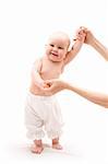 Cute happy baby girl with mother hands on white background