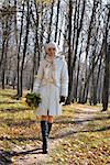 romantic girl in an autumn wood in october