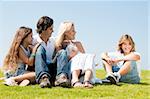 Happy family relaxing on grass