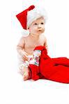 Lovely baby in santa hat with a red Christmas towe