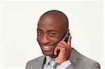 Portrait of an Afro-American businessman on phone against white