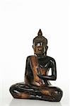 Wooden Buddha statue isolated on a white bachground