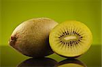 Kiwi and a half on green background