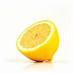 Fresh half of lemon isolated on white background facing left