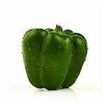 Green sweet pepper with water drops isolated on white background