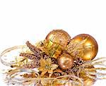 Christmas decoration - golden branch with baubles, flower, gift box and other ornaments