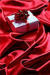 gift box on red satin background