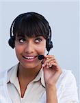 Attractive ethnic young businesswoman working in a call center