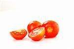 small wet fresh red tomato group isolated on white