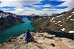 Hiking. Hiker taking a break at the spectacular Bessegen view in Jotunheimen, Norway