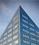 Sparse composition with office building against blue sky