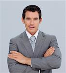 Portrait of smiling attractive businessman with folded arms