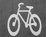 Close up of white bike painted on asphalt