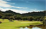 Image of a beautiful golf course fairway at a tropical resort