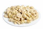 Cashew nuts in a white plate on a white background, isolated