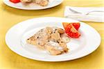 hake fillets with cheese sauce and mushrooms