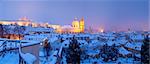 prague - panorama of hradcany castle and st. nicolaus church in winter