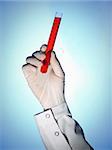 A scientist's hand holds a test tube filled with a red liquid. Blue background.