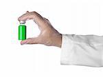 A doctor holds a vial full of green liquid with his latex gloves on. Isolated on white.