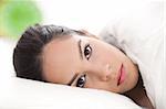 sexy lady lying in her bed,closeup shot over white background