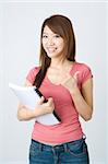 asian college girl holding a book