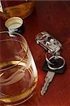 Car key and a glass with Whiskey