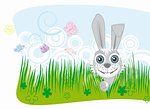 Cute bunny peeking through the grass
