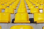 A field of yellow stadium seats.