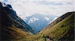 tourists hiking the inca trail overlooking ruined incan city of machu picchu near cusco in peru south america