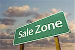 Sale Zone Green Road Sign In Front of Dramatic Clouds and Sky.