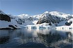 Beautiful landscape in Antartica in morning light. Some snow covered mountains.