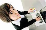 young business woman making online payment with credit card and representing concept of new age in banking and plastic money