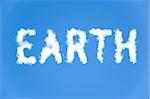 An illustration of the text earth made up of white puffy clouds to represent environmental issues or carbon footprint.