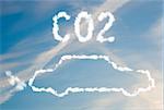 An illustration of a car with the text CO2 made up of white puffy clouds to represent environmental issues or carbon footprint.