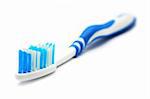 A blue white tooth brush on white background.