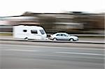 family car towing a caravan along the motorway